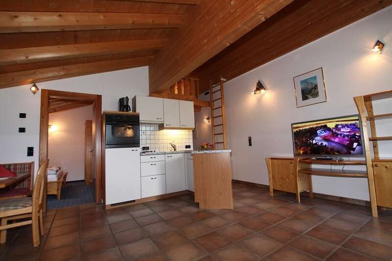 Apartment with kitchen and living area at the Seaper Ranch in Steinach am Brenner